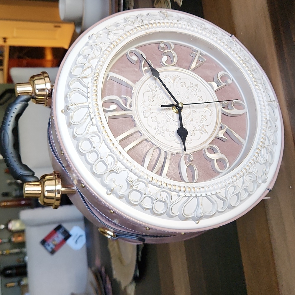 This is an vintage clock purse (it does take batteries)